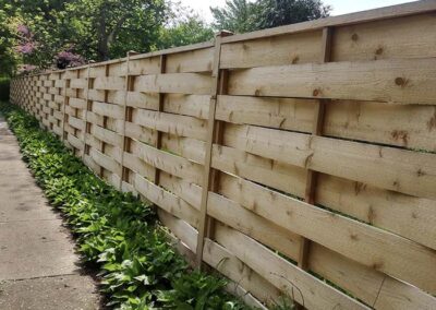 A custom wood fence, built as part of our fence installation services