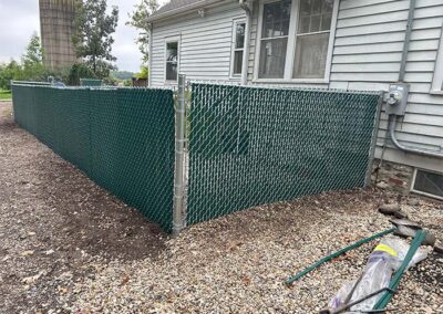 a green chain link fence