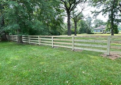 A fence along the edge of a ranch or farm