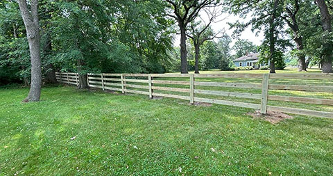 A fence along the edge of a ranch or farm